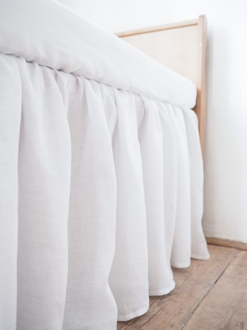 White linen crib skirt
