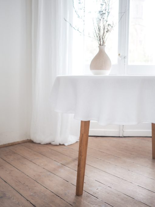 Weiße runde Leinen-Tischdecke