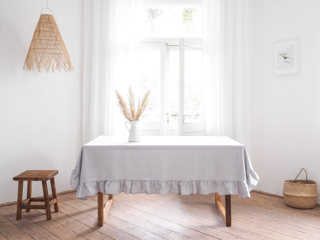 light gray linen tablecloth with a frill 