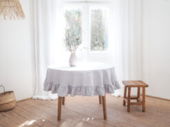 Light gray round ruffled linen tablecloth
