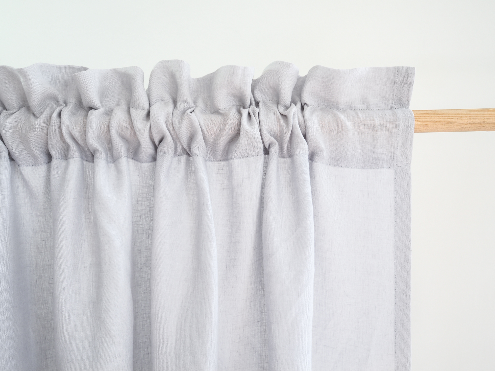 Light gray curtains with a header