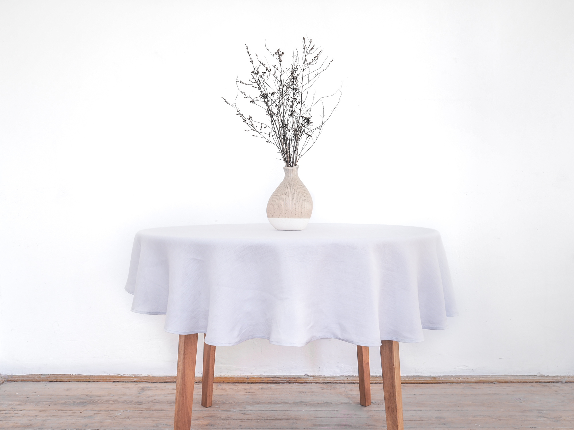 Light gray round linen tablecloth