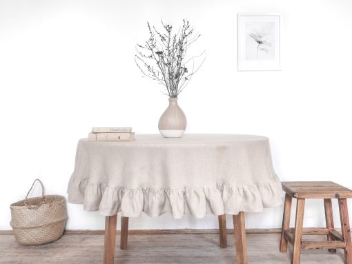 Sizeable round linen tablecloth with a frill