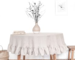 Sizeable round linen tablecloth with a frill