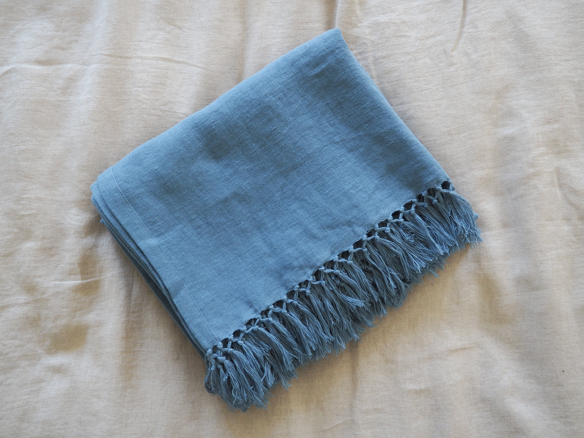Blue linen throw with fringes