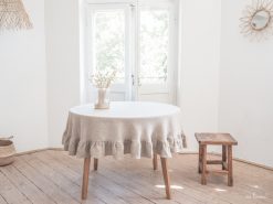 round tablecloth with a frill in rustic linen