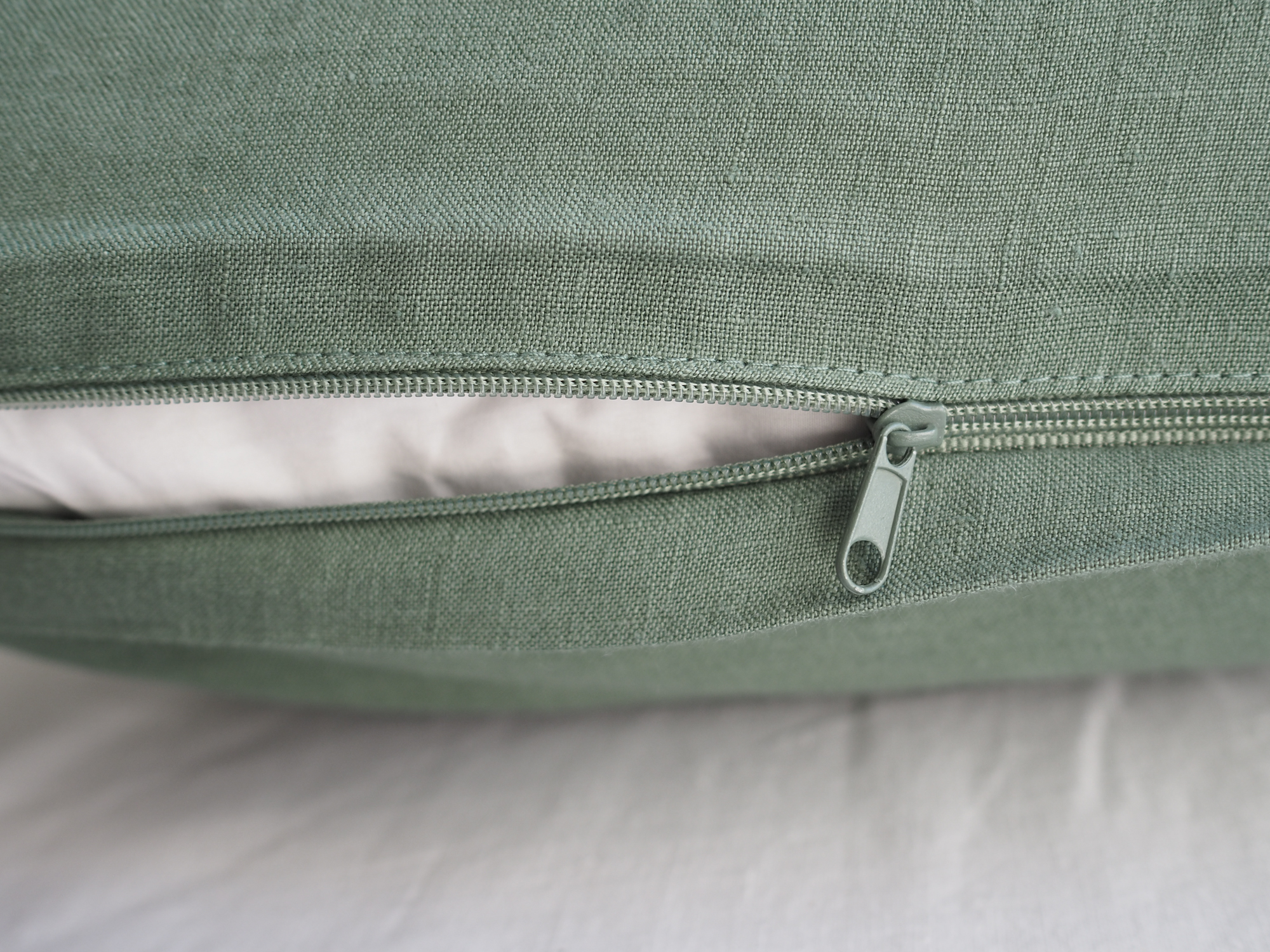 green linen bedding with a zipper