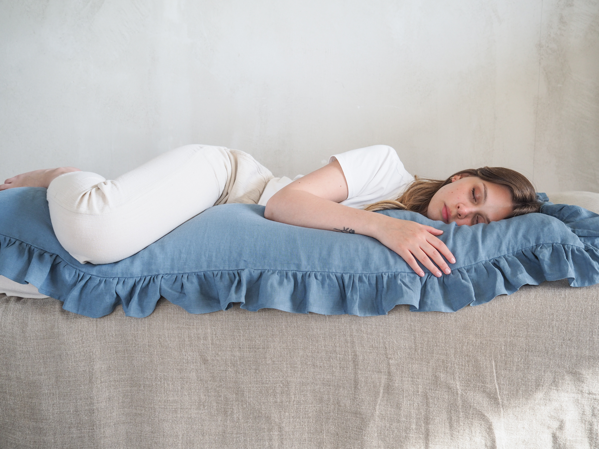 Blue linen body pillow with ruffles