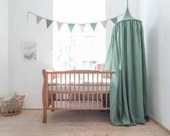 Linen canopy above the crib