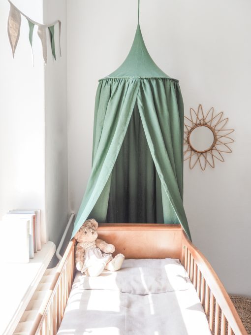 Linen canopy above the crib