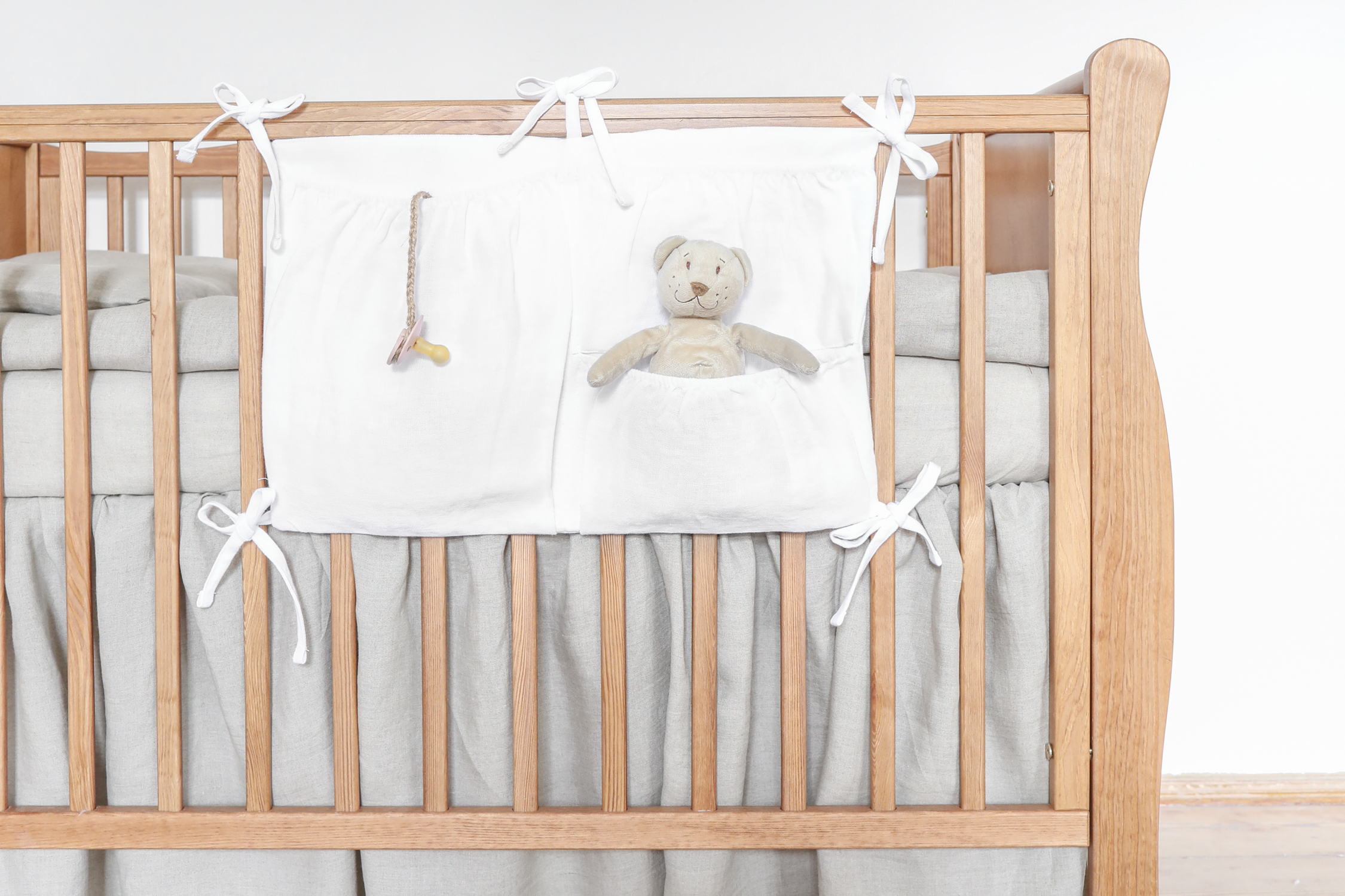 White linen crib organizer