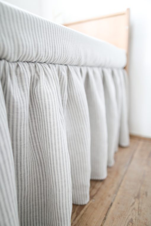 Striped gray linen crib skirt