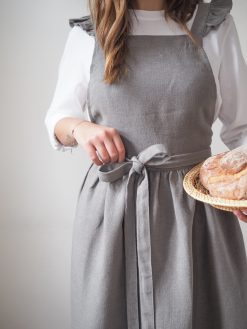 Linen apron tied at the waist